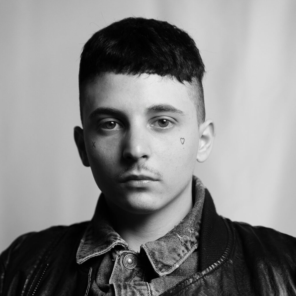 a black and white photo of a young man